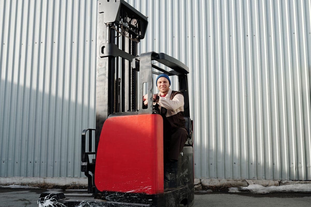 Forklift operator in warehouse